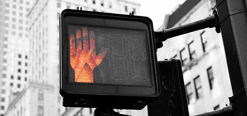 Traffic signal with "Don't Walk" symbol displayed.